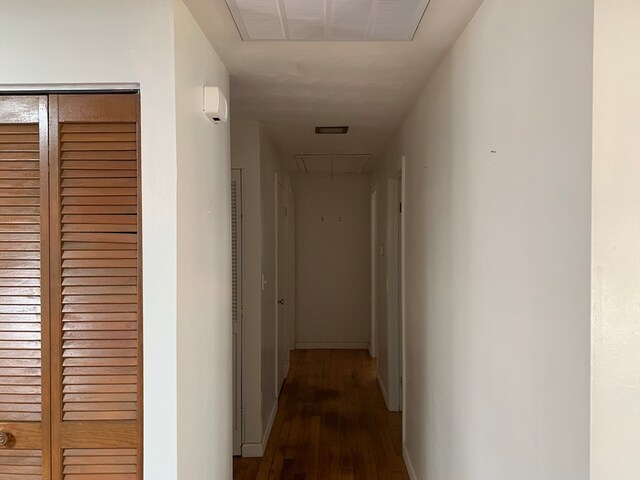 hall with dark hardwood / wood-style floors