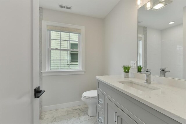 176 Medford St Unit 176, Arlington, MA 02474 - bathroom featuring vanity and marble look tiles