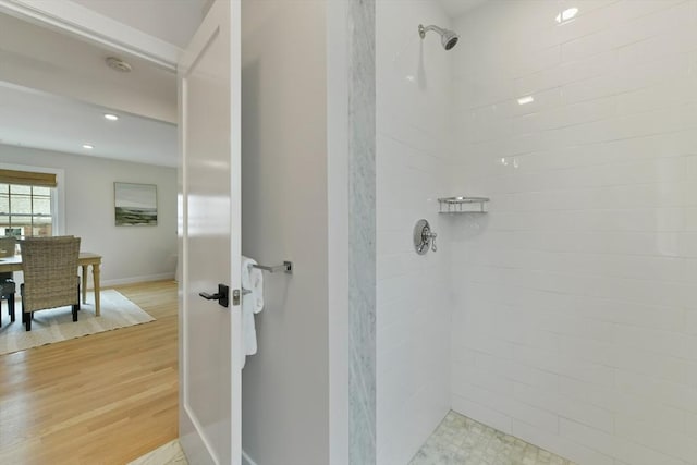 176 Medford St Unit 176, Arlington, MA 02474 - bathroom featuring tiled shower and wood finished floors