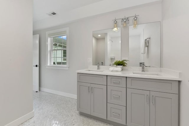 176 Medford St Unit 176, Arlington, MA 02474 - bathroom featuring double vanity and a shower