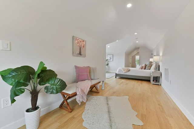 176 Medford St Unit 176, Arlington, MA 02474 - bedroom featuring lofted ceiling, wood finished floors, and recessed lighting