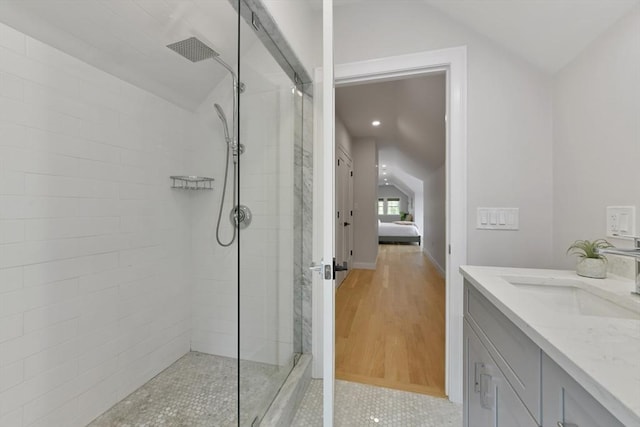 176 Medford St Unit 176, Arlington, MA 02474 - full bathroom featuring vaulted ceiling, a tile shower, vanity, and connected bathroom