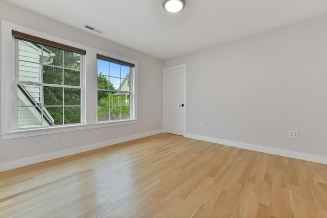 176 Medford St Unit 176, Arlington, MA 02474 - spare room featuring baseboards and light wood finished floors