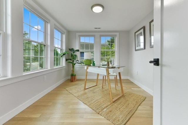 176 Medford St Unit 176, Arlington, MA 02474 - dining room with a desk and wood finished floors