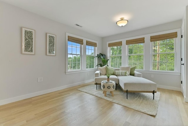 176 Medford St Unit 176, Arlington, MA 02474 - sitting room with baseboards and light wood-type flooring
