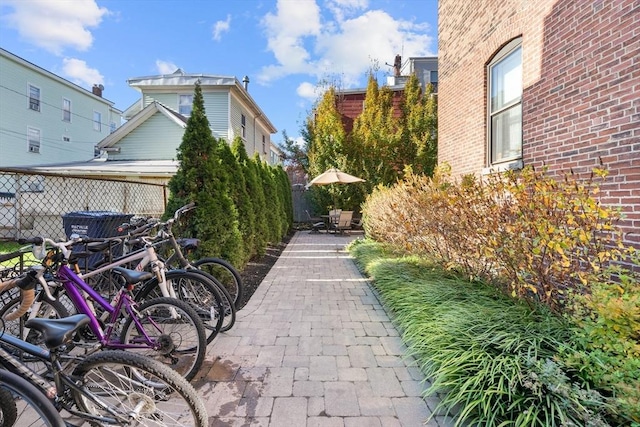 view of home's community featuring a patio and fence