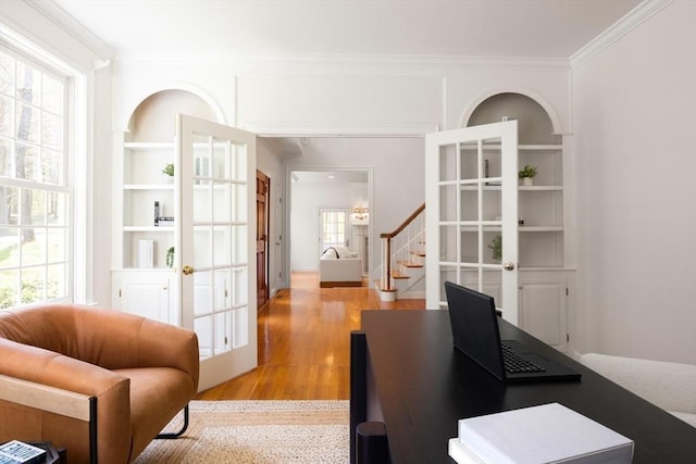 22 Forest Hill Rd, Wayland, MA 01778 - home office featuring ornamental molding, light wood-type flooring, french doors, and built in shelves