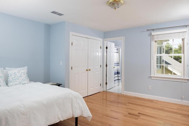 22 Forest Hill Rd, Wayland, MA 01778 - bedroom with baseboards, light wood finished floors, and a closet