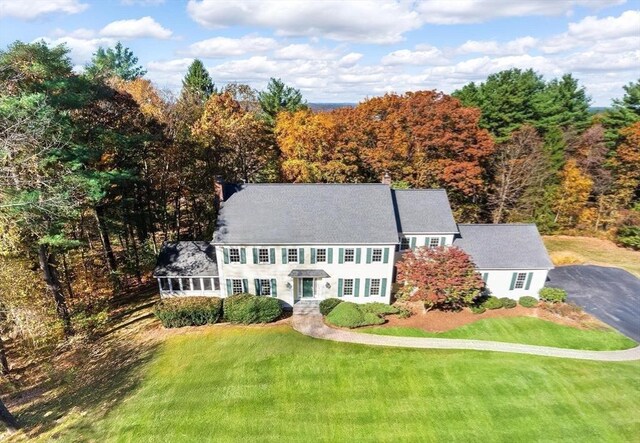22 Forest Hill Rd, Wayland, MA 01778 - view of front of house with a front lawn and a chimney