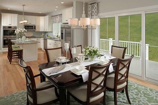 dining space featuring an inviting chandelier and light wood-type flooring