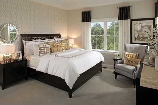 bedroom featuring light colored carpet