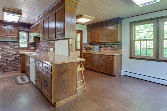 46 Baremeadow St, Methuen, MA 01844 - kitchen with wood ceiling, white dishwasher, baseboard heating, light countertops, and a breakfast bar