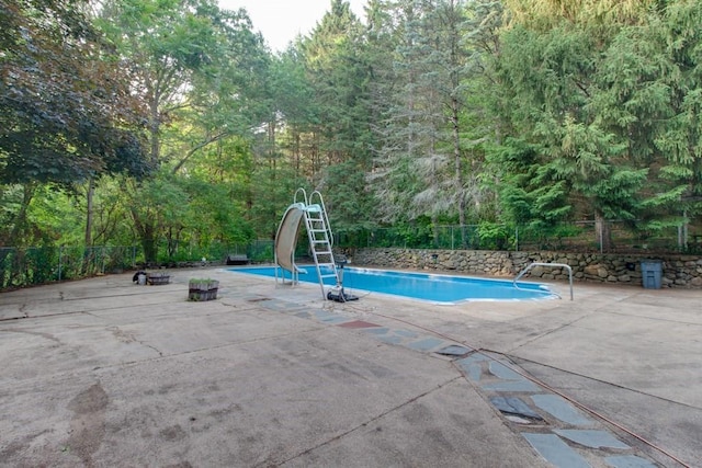 46 Baremeadow St, Methuen, MA 01844 - view of swimming pool with a water slide, a patio, and a view of trees
