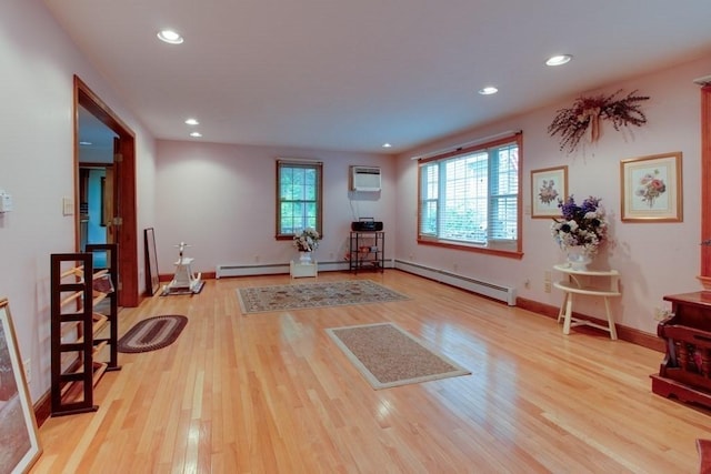 46 Baremeadow St, Methuen, MA 01844 - living area with a wall unit AC, light wood-style flooring, recessed lighting, and baseboard heating