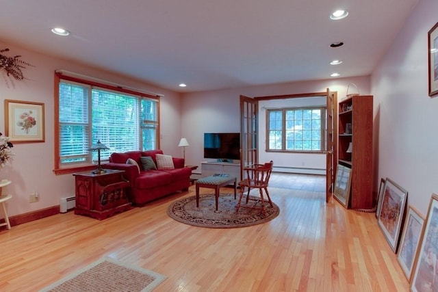 46 Baremeadow St, Methuen, MA 01844 - living room with a baseboard heating unit, light wood-style floors, and recessed lighting