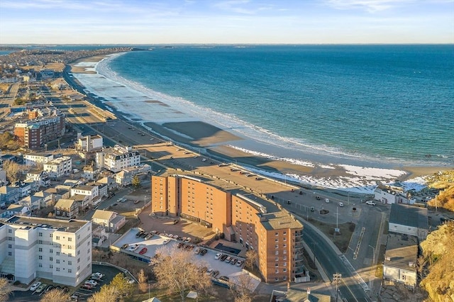 bird's eye view featuring a city view, a water view, and a beach view