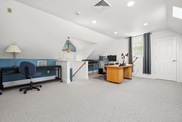 office area with visible vents, lofted ceiling, and carpet floors