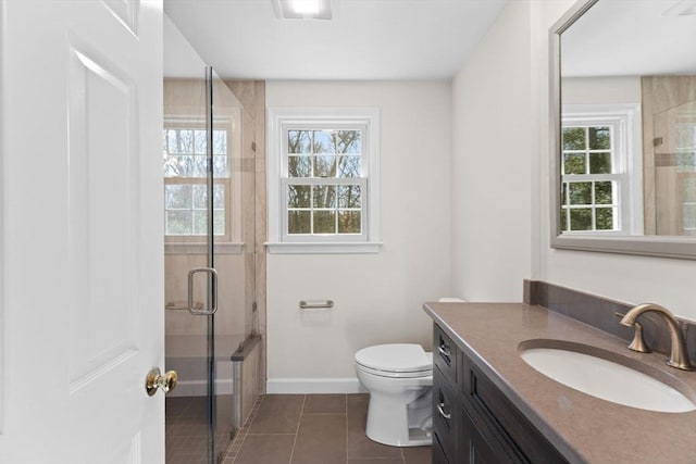 bathroom featuring tile patterned floors, a healthy amount of sunlight, baseboards, and a shower with door