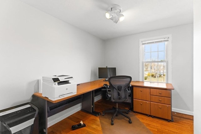 office featuring wood finished floors and baseboards