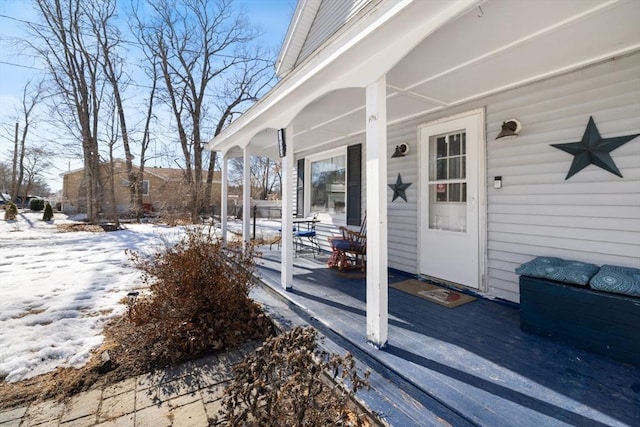 view of snow covered property entrance