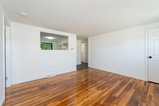 258-260 Pleasant St, Lowell, MA 01852 - unfurnished room featuring wood finished floors, baseboards, and a smoke detector