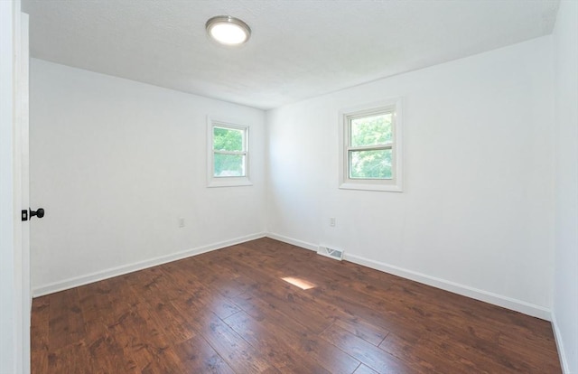 258-260 Pleasant St, Lowell, MA 01852 - unfurnished room featuring dark wood-type flooring and baseboards