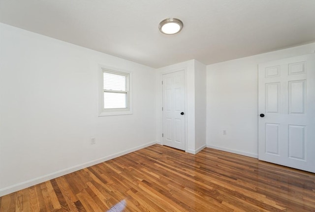 258-260 Pleasant St, Lowell, MA 01852 - unfurnished bedroom featuring baseboards and wood finished floors