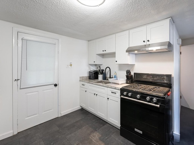 258-260 Pleasant St, Lowell, MA 01852 - kitchen featuring black gas stove, under cabinet range hood, a sink, a textured ceiling, and white cabinets
