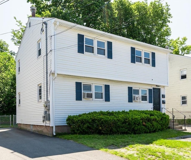 258-260 Pleasant St, Lowell, MA 01852 - colonial-style house with asphalt driveway and cooling unit