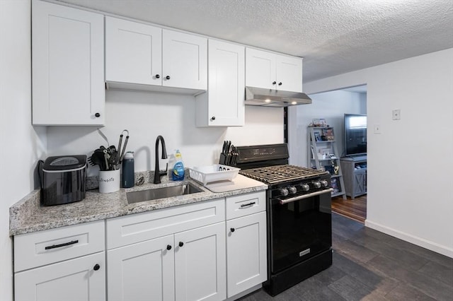 258-260 Pleasant St, Lowell, MA 01852 - kitchen with black range with gas cooktop, a sink, under cabinet range hood, white cabinetry, and dark wood-style floors