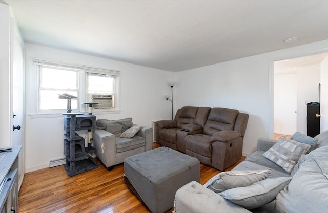 258-260 Pleasant St, Lowell, MA 01852 - living area with light wood-style floors, cooling unit, a baseboard radiator, and baseboards