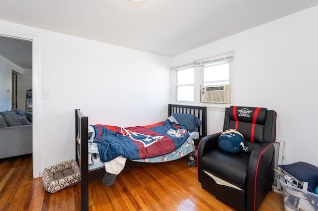 258-260 Pleasant St, Lowell, MA 01852 - bedroom with wood finished floors and cooling unit