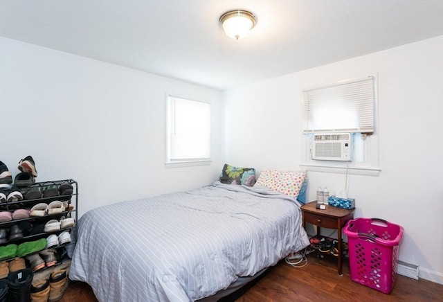 258-260 Pleasant St, Lowell, MA 01852 - bedroom featuring wood finished floors, cooling unit, and a baseboard heating unit
