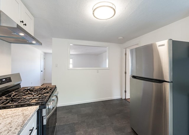 258-260 Pleasant St, Lowell, MA 01852 - kitchen featuring appliances with stainless steel finishes, extractor fan, baseboards, white cabinets, and a textured ceiling