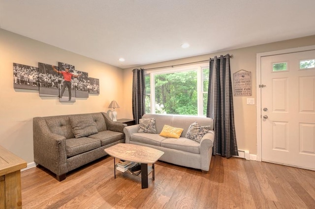 1608 Plymouth St Unit 1608, East Bridgewater, MA 02333 - living room with wood finished floors, recessed lighting, baseboards, and a baseboard radiator
