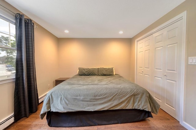 1608 Plymouth St Unit 1608, East Bridgewater, MA 02333 - bedroom with a baseboard radiator, a closet, recessed lighting, and light wood finished floors