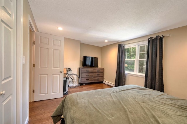 1608 Plymouth St Unit 1608, East Bridgewater, MA 02333 - bedroom with a baseboard radiator, wood finished floors, recessed lighting, and a textured ceiling