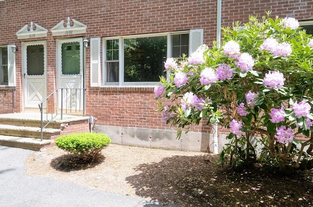 1608 Plymouth St Unit 1608, East Bridgewater, MA 02333 - view of exterior entry featuring brick siding