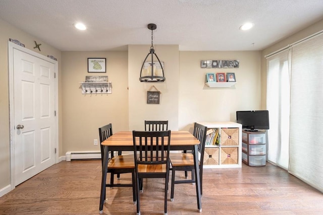 1608 Plymouth St Unit 1608, East Bridgewater, MA 02333 - dining room with baseboard heating, wood finished floors, recessed lighting, a textured ceiling, and baseboards