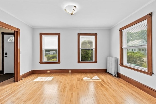 181 Myrtle St, Rockland, MA 02370 - spare room with radiator heating unit, light wood-style floors, baseboards, and ornamental molding