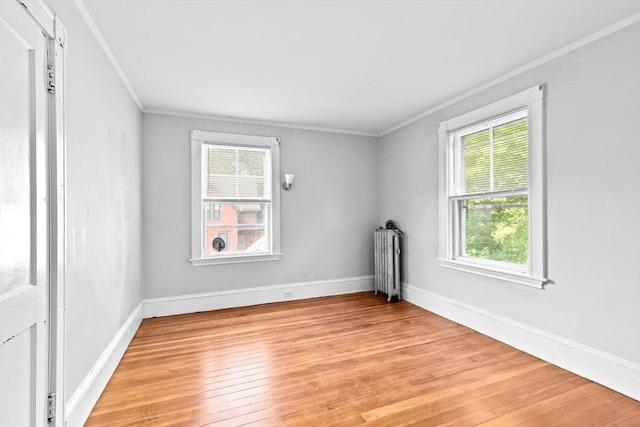 181 Myrtle St, Rockland, MA 02370 - unfurnished room with radiator, crown molding, light wood-style floors, and baseboards