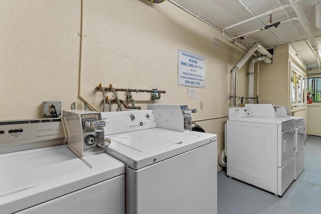 262 E Haverhill St Unit 17, Lawrence, MA 01841 - communal laundry room featuring separate washer and dryer and a textured wall
