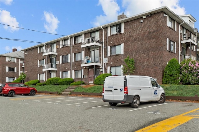 262 E Haverhill St Unit 17, Lawrence, MA 01841 - view of apartment building / complex featuring uncovered parking
