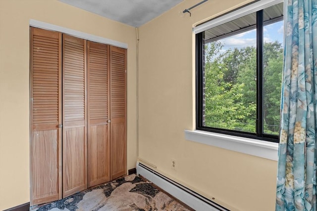 262 E Haverhill St Unit 17, Lawrence, MA 01841 - unfurnished bedroom with a closet and a baseboard heating unit