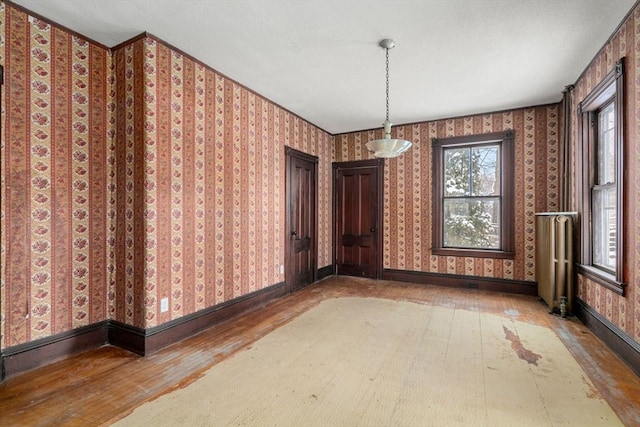 unfurnished dining area with hardwood / wood-style flooring