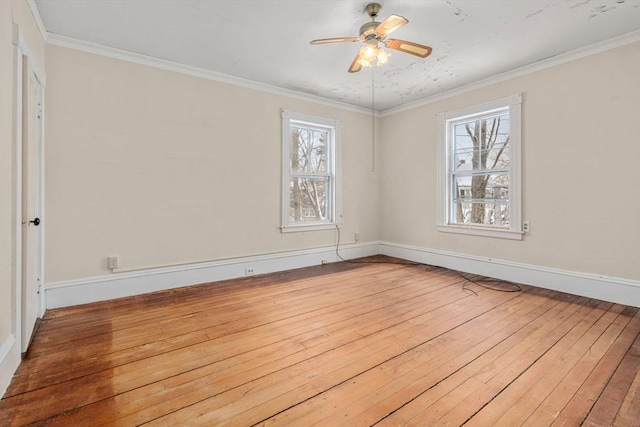 unfurnished room featuring ceiling fan, hardwood / wood-style floors, and ornamental molding