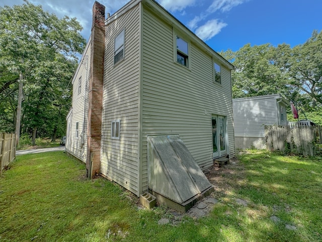 view of home's exterior featuring a lawn