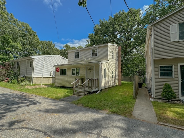 view of front of property with a front lawn