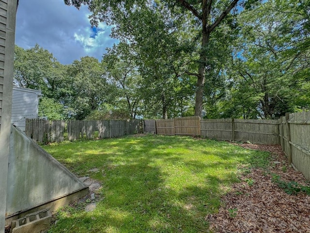 view of yard with a fenced backyard