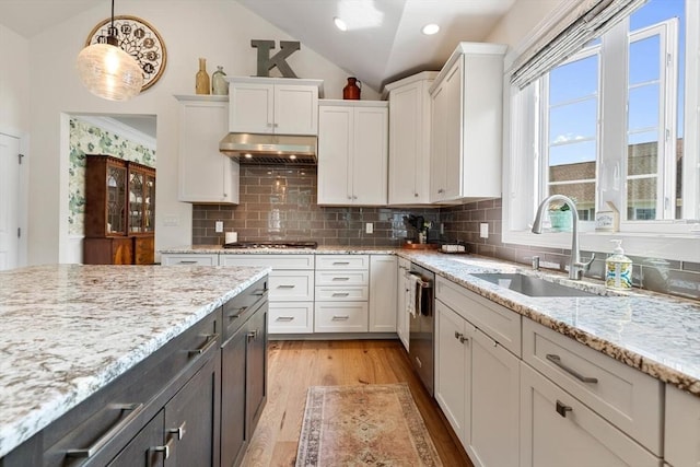 109 Phoebe St Unit 109, Methuen, MA 01844 - kitchen featuring lofted ceiling, white cabinetry, light wood-type flooring, gas stovetop, and pendant lighting